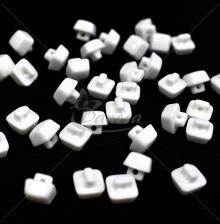 Square white trapezoid-shaped shank button 16L