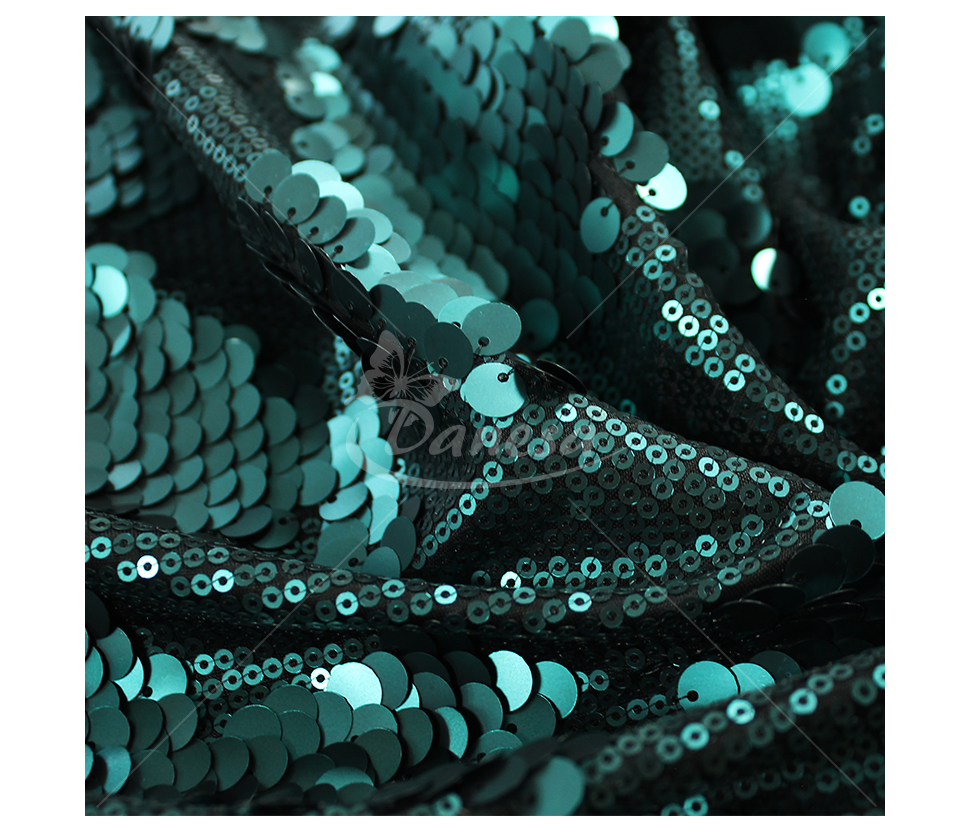 Fabric embroidered with scales
