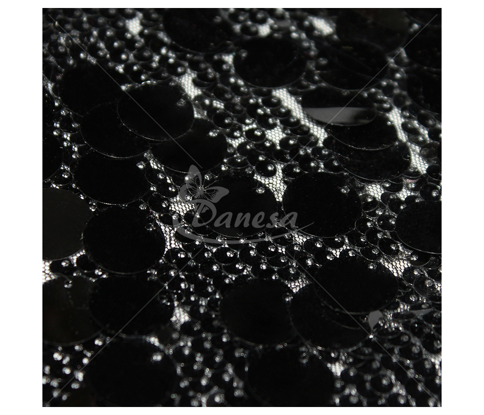Fabric embroidered with scales