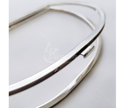 Metal fittings for handbags, wallets and purses