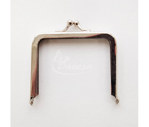 Metal fittings for handbags, wallets and purses