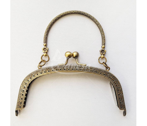 Metal fittings for handbags, wallets and purses