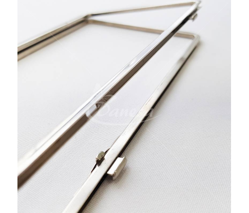 Metal fittings for handbags, wallets and purses