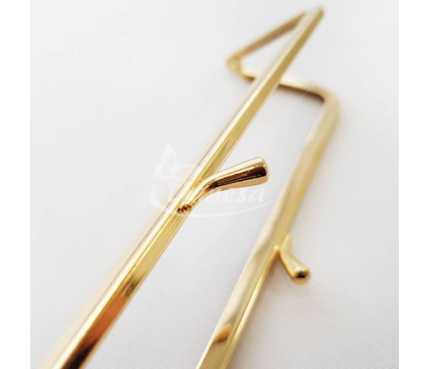 Metal fittings for handbags, wallets and purses