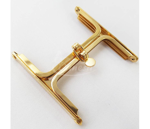 Metal fittings for handbags, wallets and purses