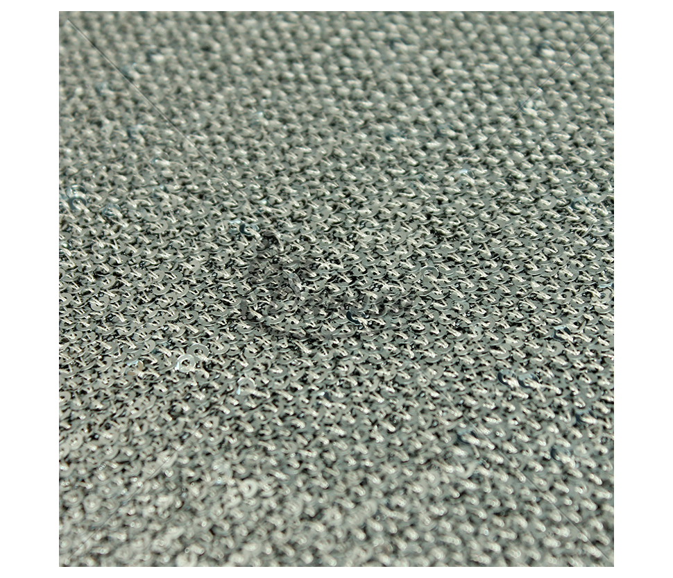 Fabric embroidered with scales