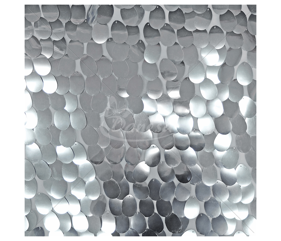 The fabric is embroidered with large scales