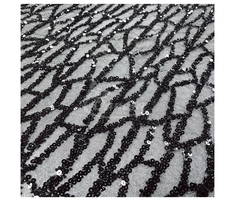 Fabric embroidered with scales