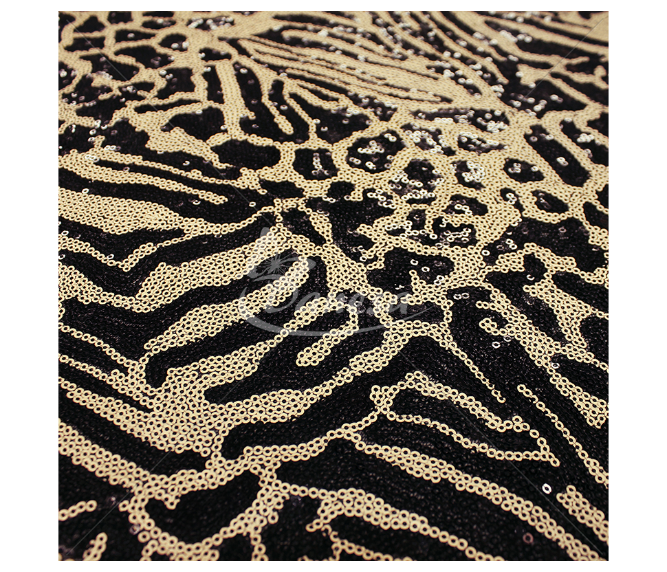 Fabric embroidered with scales