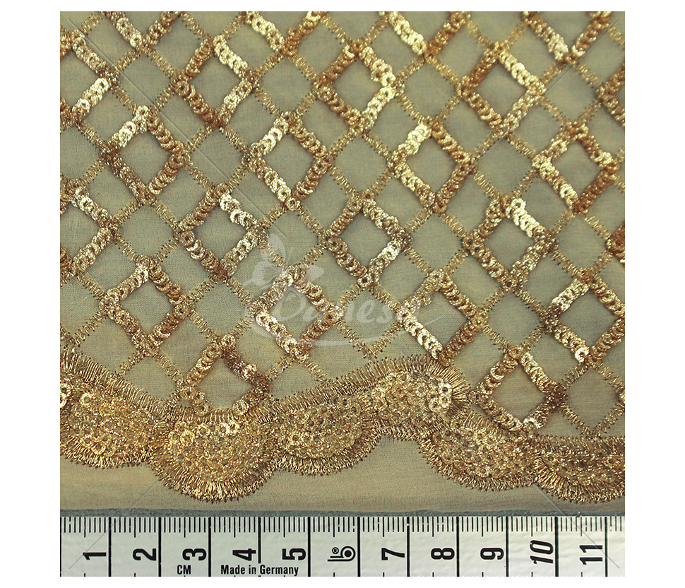 Fabric embroidered with scales