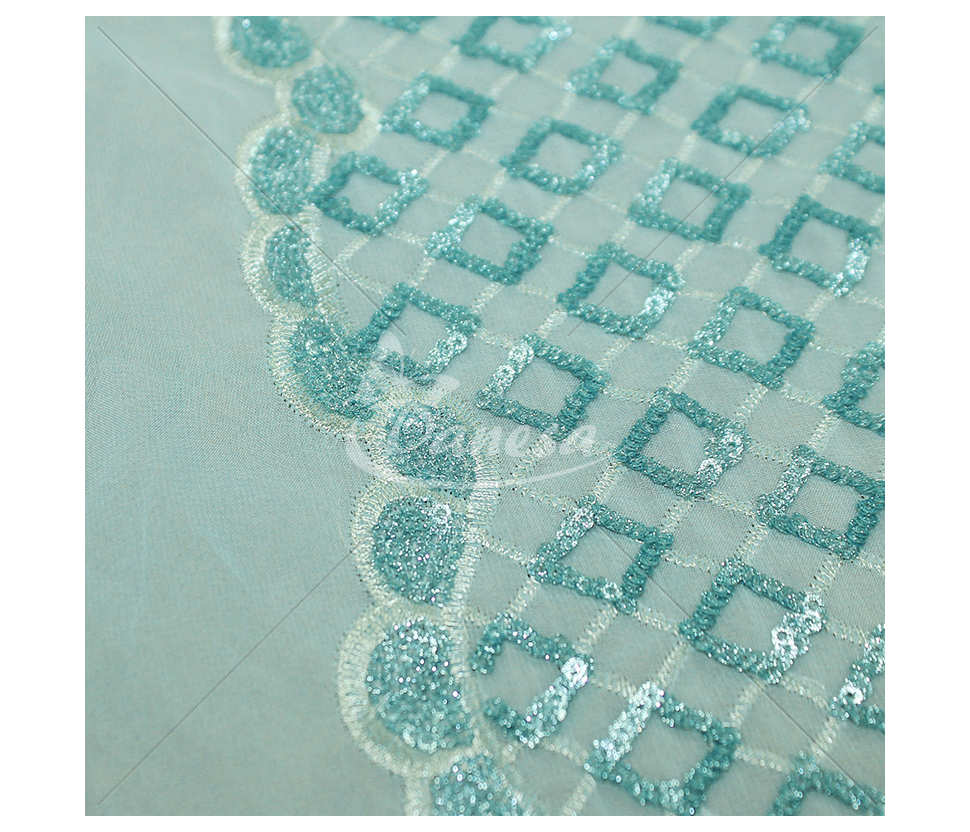 Fabric embroidered with scales