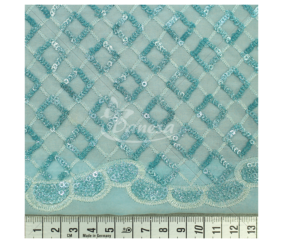 Fabric embroidered with scales