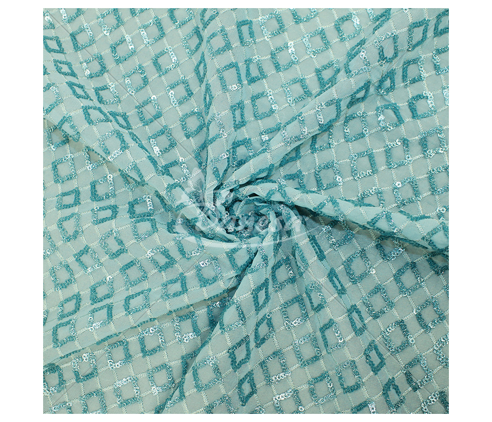 Fabric embroidered with scales