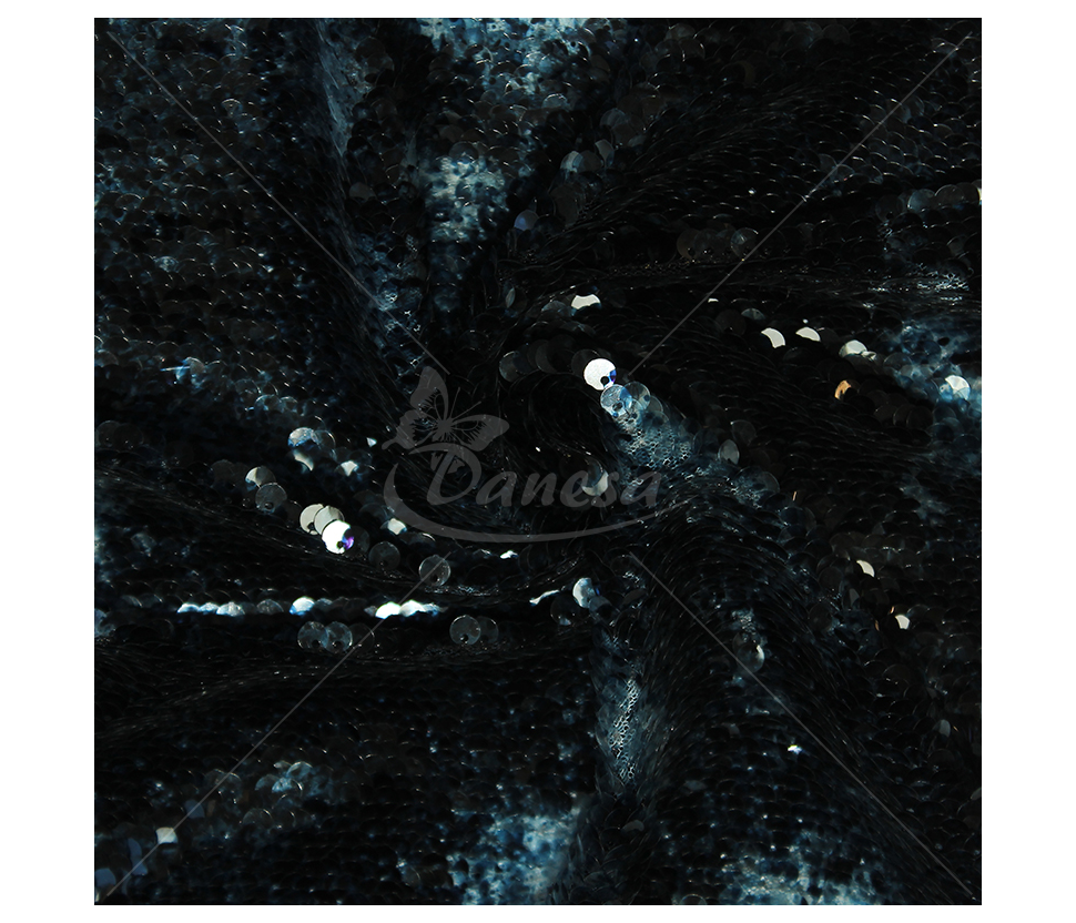 Fabric embroidered with scales