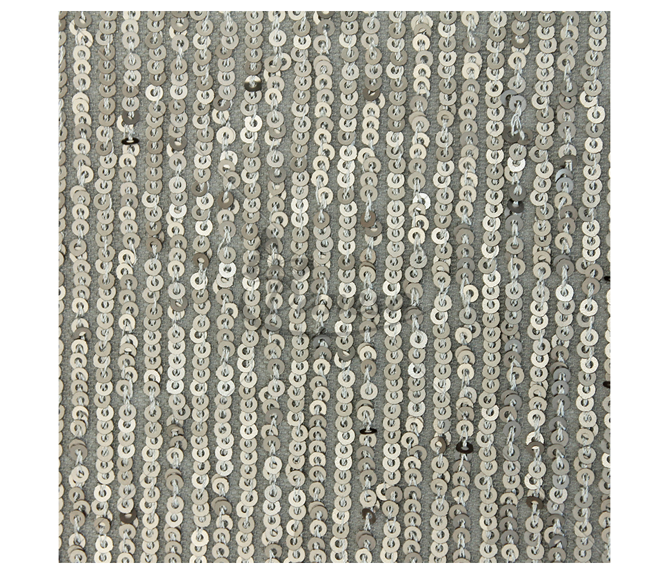 Fabric embroidered with scales