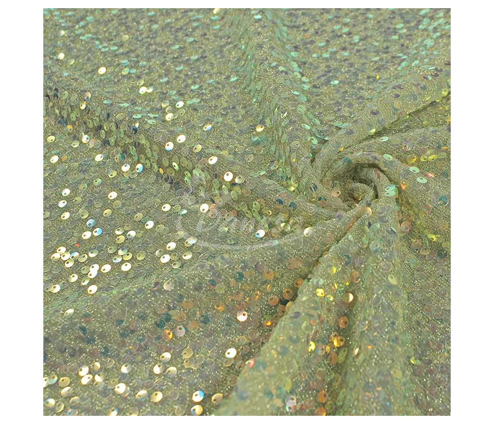 Fabric embroidered with scales