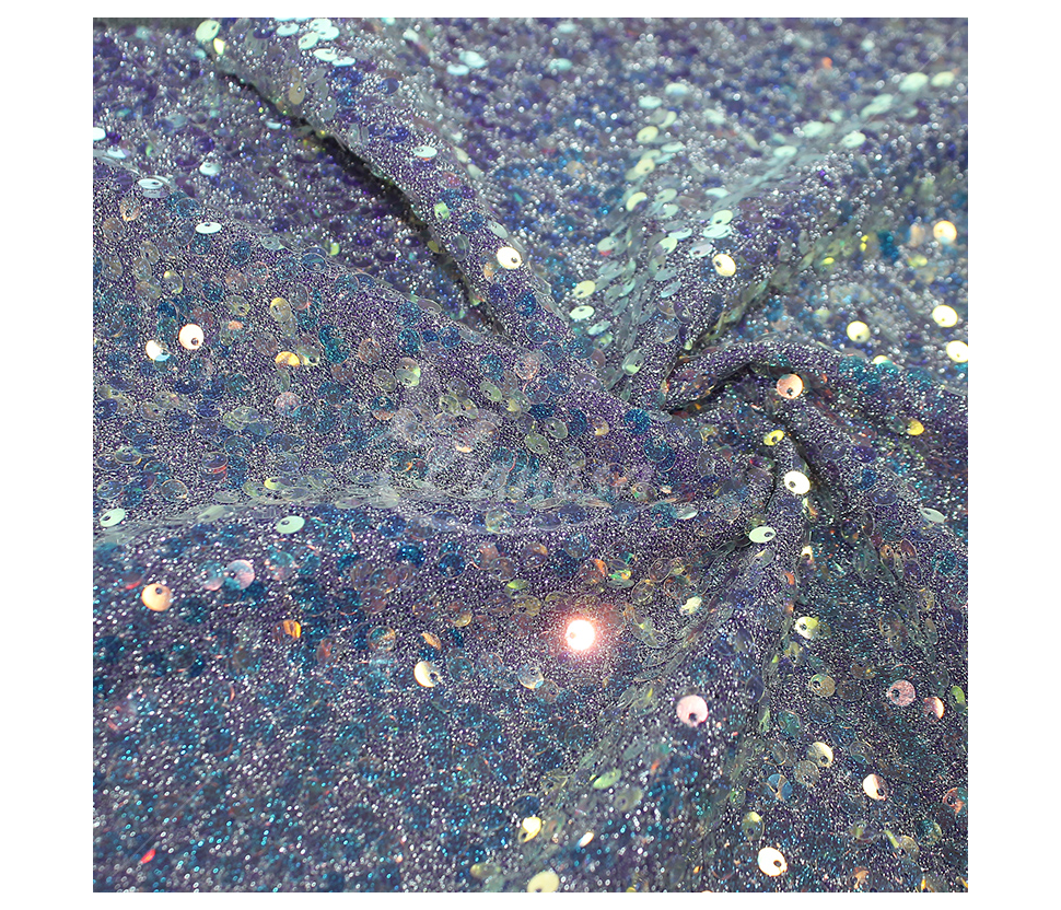 Fabric embroidered with scales