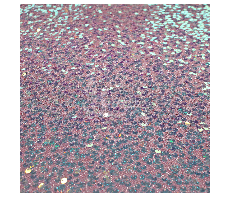 Fabric embroidered with scales