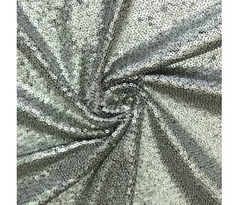 Fabric embroidered with scales