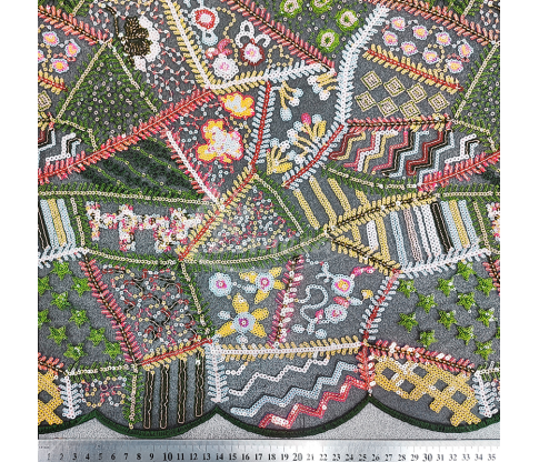 Fabric embroidered with scales