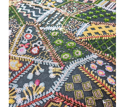Fabric embroidered with scales