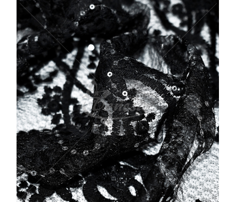 Guipure, with a floral pattern and embroidered with sequins, black color