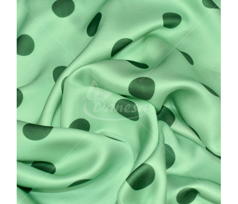 Satin weave viscose fabric, light green with darker green polka dots